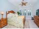 Spacious bedroom with king-size bed and wood furniture at 717 Manns Harbor Dr, Apollo Beach, FL 33572