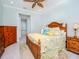 Spacious bedroom with wood furniture and en-suite bathroom access at 717 Manns Harbor Dr, Apollo Beach, FL 33572