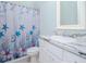 Small bathroom with shower and nautical theme at 717 Manns Harbor Dr, Apollo Beach, FL 33572