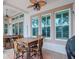 Outdoor patio with seating area, dining table, and a grill at 717 Manns Harbor Dr, Apollo Beach, FL 33572