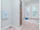 Spa-like bathroom with soaking tub and walk-in shower at 717 Manns Harbor Dr, Apollo Beach, FL 33572