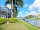 This property boasts a picturesque view of the canal and lush landscaping at 717 Manns Harbor Dr, Apollo Beach, FL 33572