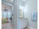 Light and bright bathroom with granite countertop and white cabinets at 717 Manns Harbor Dr, Apollo Beach, FL 33572
