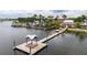 Private wooden dock with covered seating area, perfect for relaxing at 717 Manns Harbor Dr, Apollo Beach, FL 33572