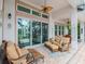 Relaxing patio area with comfortable seating and a view of the pool at 717 Manns Harbor Dr, Apollo Beach, FL 33572