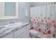 Clean bathroom with shower/tub combo and starfish theme at 717 Manns Harbor Dr, Apollo Beach, FL 33572