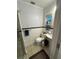 Bathroom featuring a toilet, vanity, shower, and a window for natural light at 860 19 N Ave, St Petersburg, FL 33704