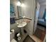 Small bathroom with wainscoting, pedestal sink, and toilet at 860 19 N Ave, St Petersburg, FL 33704