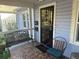 Welcoming front porch features stylish seating and a decorative security door at 860 19 N Ave, St Petersburg, FL 33704