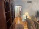 Living room featuring hardwood floors, a large bookcase, and a view of adjoining rooms at 860 19 N Ave, St Petersburg, FL 33704
