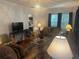 Comfortable living room with hardwood floors, a chandelier, and ample natural light at 860 19 N Ave, St Petersburg, FL 33704
