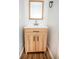 Modern bathroom with light wood vanity and a framed mirror at 1935 Oxnard Ct, Tampa, FL 33612