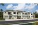 Modern townhouses with attached garages and landscaping at 11404 Crescent Deer Dr, Land O Lakes, FL 34638