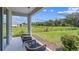 Covered lanai overlooking a tranquil backyard at 11400 Crescent Deer Dr, Land O Lakes, FL 34638