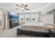 Main bedroom with king bed, large TV, and ensuite bathroom at 2848 Gridiron Isle, New Port Richey, FL 34655