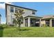 Two story home with covered patio and fenced backyard at 2848 Gridiron Isle, New Port Richey, FL 34655