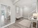 Bright and airy entryway with tile flooring, bench, and large mirror at 2848 Gridiron Isle, New Port Richey, FL 34655