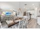 Open concept kitchen with island, stainless steel appliances, and white cabinetry at 2848 Gridiron Isle, New Port Richey, FL 34655