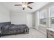 Spacious bedroom with plush carpet and ceiling fan at 2848 Gridiron Isle, New Port Richey, FL 34655