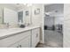 Double vanity bathroom with access to another room at 2848 Gridiron Isle, New Port Richey, FL 34655