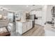 Eat-in kitchen with island, stainless steel appliances, and white cabinets at 2848 Gridiron Isle, New Port Richey, FL 34655