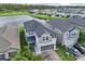 Two-story house with a two-car garage and a pond nearby at 2848 Gridiron Isle, New Port Richey, FL 34655