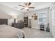 Spacious bedroom with large bed, dresser, and bookcase at 2848 Gridiron Isle, New Port Richey, FL 34655