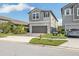 Two-story house with gray siding, two-car garage, and a fire hydrant nearby at 2848 Gridiron Isle, New Port Richey, FL 34655