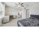 Well-lit bedroom featuring a built-in desk and ensuite access at 2848 Gridiron Isle, New Port Richey, FL 34655