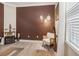 Relaxing sitting area in the home office, featuring a comfortable armchair at 2848 Gridiron Isle, New Port Richey, FL 34655