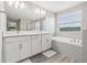 Double vanity bathroom with soaking tub and separate shower at 2848 Gridiron Isle, New Port Richey, FL 34655