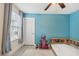 bedroom with blue walls and playful decor at 2848 Gridiron Isle, New Port Richey, FL 34655