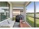 Relaxing screened patio with outdoor furniture and water view at 2848 Gridiron Isle, New Port Richey, FL 34655