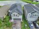 Two-story house with a two-car garage and a pond nearby at 2848 Gridiron Isle, New Port Richey, FL 34655