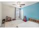 bedroom with blue walls and playful decor at 2848 Gridiron Isle, New Port Richey, FL 34655