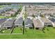 Aerial view of homes with backyard and community at 2848 Gridiron Isle, New Port Richey, FL 34655