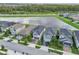Aerial view of houses and lakefront community at 2848 Gridiron Isle, New Port Richey, FL 34655