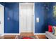 Modern elevator with blue walls and carpet at 5823 Bowen Daniel Dr # 906, Tampa, FL 33616