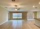 Bright living room with tile floors and sliding glass doors at 10411 Alder Green Dr, Riverview, FL 33578