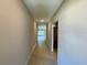 Bright hallway with tile flooring leading to other rooms at 10411 Alder Green Dr, Riverview, FL 33578