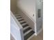 Modern stairs with gray and white wood at 505 Kensington Lake Cir, Brandon, FL 33511