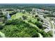 Stunning aerial view of a golf course community surrounded by lush greenery and tranquil lakes at 11920 Boynton Ln # 11920, New Port Richey, FL 34654