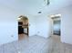 Inviting dining room with tile flooring, and a view of the kitchen at 11920 Boynton Ln # 11920, New Port Richey, FL 34654