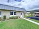 Charming home with a metal roof, well-maintained lawn, and a convenient carport at 11920 Boynton Ln # 11920, New Port Richey, FL 34654