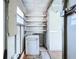 Utility room with pegboard, a washer, dryer, and storage shelving, offering practical functionality at 11920 Boynton Ln # 11920, New Port Richey, FL 34654