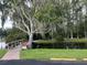 Charming community pond with a wooden bridge and lush greenery, enhancing the serene environment at 11920 Boynton Ln # 11920, New Port Richey, FL 34654