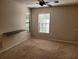 Simple bedroom with neutral walls, carpeted floor, and a window at 10908 Claymont Dr, New Port Richey, FL 34654