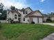 Two-story house with a two-car garage at 10908 Claymont Dr, New Port Richey, FL 34654