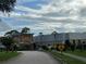 Exterior view of community center with landscaping and parking at 11920 Boynton Ln # 11920, New Port Richey, FL 34654
