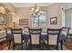 Formal dining room with a large table, chandelier, and hardwood floors at 20617 Broadwater Dr, Land O Lakes, FL 34638